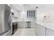 Updated kitchen with stainless steel appliances, gray cabinets, and white subway tile backsplash at 3978 Overlook Bend Ter # 25, Sarasota, FL 34232