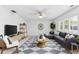 Contemporary living room featuring stylish furniture, large windows, and modern décor at 3978 Overlook Bend Ter # 25, Sarasota, FL 34232