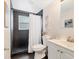 Bathroom featuring a modern vanity, walk-in shower with tiled walls, and updated fixtures at 4151 Olive Ave, Sarasota, FL 34231