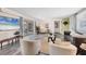 Inviting living room with sliding glass doors to screened lanai, sleek gray floors, and comfortable seating at 4151 Olive Ave, Sarasota, FL 34231