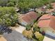 Aerial view of single-story home showcasing mature landscaping, neighborhood streets, and trees at 4203 Carriage Dr # 27, Sarasota, FL 34241
