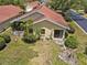 Aerial view of single-story home showcasing mature landscaping and screened in back porch at 4203 Carriage Dr # 27, Sarasota, FL 34241