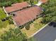 Expansive home showcasing a well-maintained exterior, complemented by lush landscaping and a charming neighborhood setting at 4203 Carriage Dr # 27, Sarasota, FL 34241