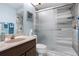 Bathroom showcasing a marble sink, glass shower and shower bench at 4203 Carriage Dr # 27, Sarasota, FL 34241