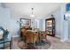 Cozy dining area featuring wood-look flooring, a glass table, and blue wall accents at 4203 Carriage Dr # 27, Sarasota, FL 34241