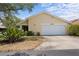 Charming single-story home featuring a well-manicured lawn and a two-car garage at 4203 Carriage Dr # 27, Sarasota, FL 34241