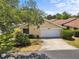 Charming single-story home featuring a well-manicured lawn and a two-car garage at 4203 Carriage Dr # 27, Sarasota, FL 34241