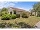 Charming single-story home with lush green lawns and mature manicured shrubs at 4203 Carriage Dr # 27, Sarasota, FL 34241