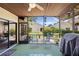 Relaxing screened patio with ceiling fan and outdoor seating, perfect for entertaining at 4203 Carriage Dr # 27, Sarasota, FL 34241