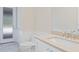 Clean bathroom featuring mosaic tile flooring, single vanity, and modern fixtures at 430 Pheasant Way, Sarasota, FL 34236