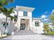 Grand home entrance featuring stone accents, modern railings, and elegant landscaping at 430 Pheasant Way, Sarasota, FL 34236