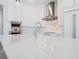 Bright kitchen featuring stainless steel appliances, a marble countertop island, and modern fixtures at 430 Pheasant Way, Sarasota, FL 34236