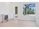Bright living room with an adjacent bar featuring a wine cooler and access to the lanai at 430 Pheasant Way, Sarasota, FL 34236