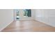 Bright living room boasts light wood flooring, modern trim details, and natural light at 430 Pheasant Way, Sarasota, FL 34236
