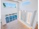 Elegant living room with a view of the pool, high ceilings, and custom millwork details at 430 Pheasant Way, Sarasota, FL 34236