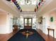 Spacious lobby area with decorative flooring, flags, and a view to the exterior at 430 Pheasant Way, Sarasota, FL 34236