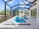 Stunning screened-in pool with tropical landscaping and ample space for lounging at 430 Pheasant Way, Sarasota, FL 34236