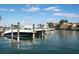 Picturesque waterfront featuring boats docked along a canal with homes in the background at 430 Pheasant Way, Sarasota, FL 34236