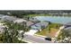 Aerial view of a home on a lakefront property in a serene neighborhood at 4406 Rustling Pines Ter, Parrish, FL 34219