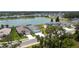 Stunning aerial view of homes in a lakeside community with lush green lawns and beautiful landscaping at 4406 Rustling Pines Ter, Parrish, FL 34219