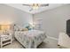 Cozy bedroom with tile flooring, a ceiling fan, and a window for natural light at 4406 Rustling Pines Ter, Parrish, FL 34219