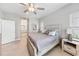 Bedroom with neutral tones, large windows, and comfortable furnishings at 4406 Rustling Pines Ter, Parrish, FL 34219