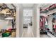Walk-in closets offer ample storage space, connecting to the main bedroom at 4406 Rustling Pines Ter, Parrish, FL 34219