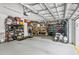 Well-organized and spacious garage with ample storage and a functional workbench area at 4406 Rustling Pines Ter, Parrish, FL 34219