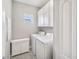 Well-organized laundry room with washer, dryer, and ample storage space at 4406 Rustling Pines Ter, Parrish, FL 34219