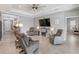 Cozy living room features comfortable seating, fireplace, ceiling fan, and modern decor at 4406 Rustling Pines Ter, Parrish, FL 34219