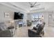 Spacious living room features recessed lighting, tile floors, and access to the backyard at 4406 Rustling Pines Ter, Parrish, FL 34219