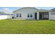 The home boasts a spacious lawn with an extended patio and a screened lanai at 4503 Lindever Ln, Palmetto, FL 34221