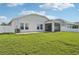 The home boasts a spacious lawn with an extended patio and a screened lanai at 4503 Lindever Ln, Palmetto, FL 34221