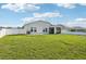 The home boasts a spacious lawn with an extended patio and a screened lanai at 4503 Lindever Ln, Palmetto, FL 34221