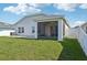 The home boasts a spacious lawn with an extended patio and a screened lanai at 4503 Lindever Ln, Palmetto, FL 34221