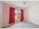 Bedroom featuring red accents and curtains with light gray carpets at 4503 Lindever Ln, Palmetto, FL 34221