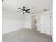 A comfortable bedroom with an open door to the bathroom and a modern ceiling fan at 4503 Lindever Ln, Palmetto, FL 34221