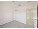A bright bedroom features neutral carpet, a ceiling fan, and a closet with sliding doors at 4503 Lindever Ln, Palmetto, FL 34221