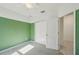 Bedroom with gray carpet, ceiling fan, two-tone paint and closet at 4503 Lindever Ln, Palmetto, FL 34221