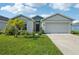 Charming single-story home with a well-manicured lawn and a two-car garage at 4503 Lindever Ln, Palmetto, FL 34221