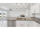 Kitchen with stainless steel dishwasher, granite countertops, and modern pendant lights at 4503 Lindever Ln, Palmetto, FL 34221