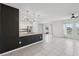 Contemporary kitchen with granite countertops, modern lighting, and stainless steel appliances at 4503 Lindever Ln, Palmetto, FL 34221
