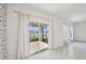 Living room with sliding doors to a screened patio, letting in plenty of natural light at 4503 Lindever Ln, Palmetto, FL 34221