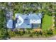 An aerial view of the property, highlighting the house layout, pool, and landscaping at 4505 Camino Real, Sarasota, FL 34231
