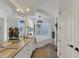 Bright bathroom with double vanity, soaking tub, and decorative lighting at 4505 Camino Real, Sarasota, FL 34231