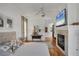 Bedroom with hardwood floors, fireplace and ensuite bathroom at 4505 Camino Real, Sarasota, FL 34231