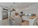 Bright, updated kitchen with stainless steel appliances and an island with barstool seating at 4505 Camino Real, Sarasota, FL 34231