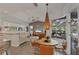 Open-concept living and dining area filled with natural light and stylish decor at 4505 Camino Real, Sarasota, FL 34231