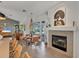 Cozy living space featuring a fireplace and seamless transition to outdoor patio seating at 4505 Camino Real, Sarasota, FL 34231