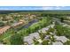 A scenic aerial shot highlights the community's location near a golf course, lake, and natural beauty at 4505 Kingsmere # 2, Sarasota, FL 34235